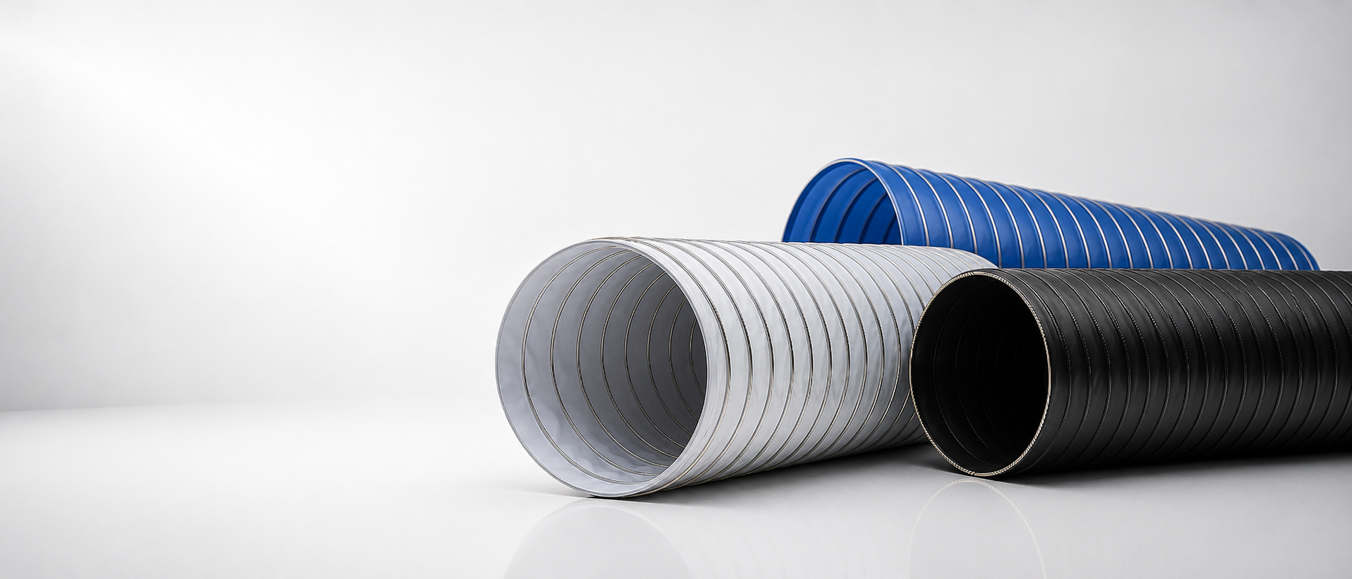 White, black and blue FluoFlex PTFE flexible ducts